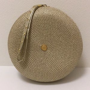 Gold straw, round clutch.